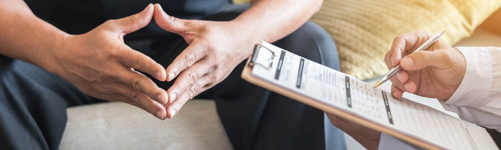 Naturopathic doctor doing an assessment with a patient